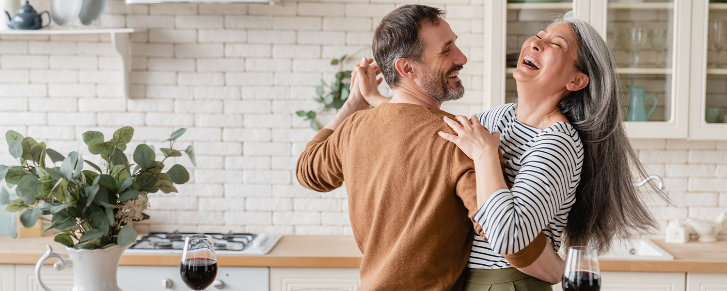 Couple dancing in a kitchen