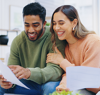Man and woman reading a document